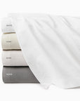 Perrio coverlet stack top to bottom: white, ivory, bone, silver labeled