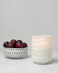 Alveare bowl with fruit and the lit hurricane