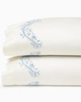 Isabella Ivory/Sea pillowcase pair stacked.