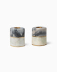 Lunario marble-textured candle holders with gold accents