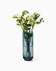 Minerva Blue crystal vase with white flowers