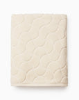 Oasi ivory bath sheet folded