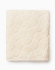Oasi ivory bath towel folded