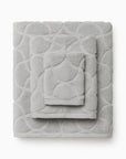 Oasi platinum bath towel, hand towel, and wascloth folded and stacked