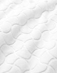 Close-up of textured oasi white bath linens