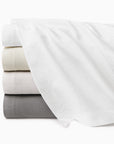 Perrio coverlet stack top to bottom: white, ivory, bone, silver.