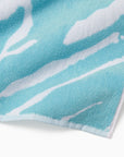 Close-up of a blue towel with white pattern sampieri clearwater beach towel