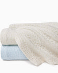 SFERRAxScalamandré Aurelia coverlets in white/sand & white/poolside stacked