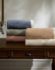 Taormina throw blankets folded and stacked
