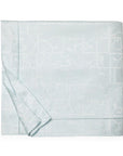 A SFERRA Graticcio Duvet Cover in pale blue folded into a square against a white background.