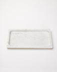 Rectangular gold-trimmed marble storage tray against a white background.