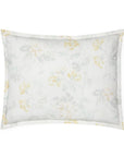 White cotton percale sham with a light yellow floral motif against a white background.