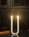 U Candle by Glaze Studio is a hand-poured, dual burning candle made of 100% white beeswax, sold by SFERRA.