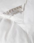 A hypoallergenic microfiber fills SFERRA's Arcadia down alternative duvet.