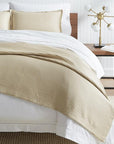 A luxury SFERRA cotton bed skirt in a woven honeycomb pattern. The Favo Collection is available in an array of colors.