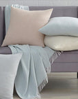 Terzo pillows and throws feature a classic basket weave pattern in soft, versatile colors.