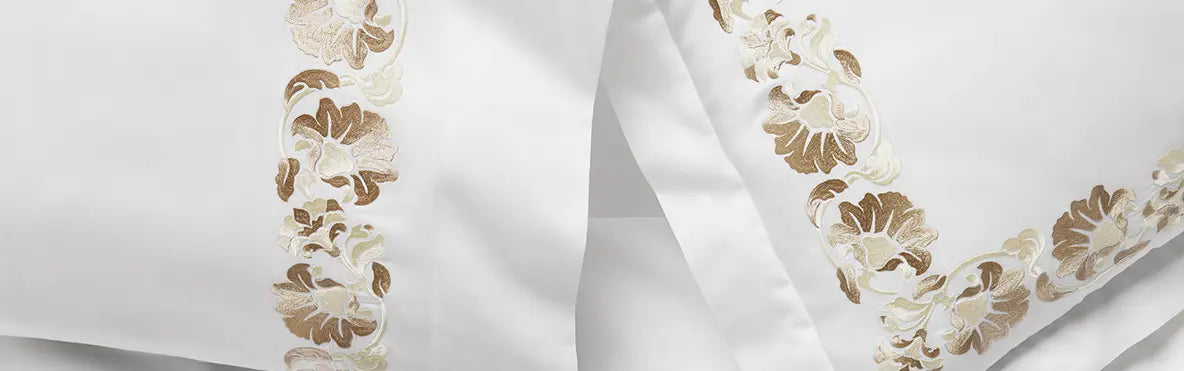 A close-up shot of a bed with pink bedding.