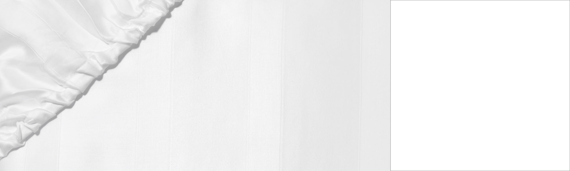 A bedroom with blue and grey plaid bedding. 