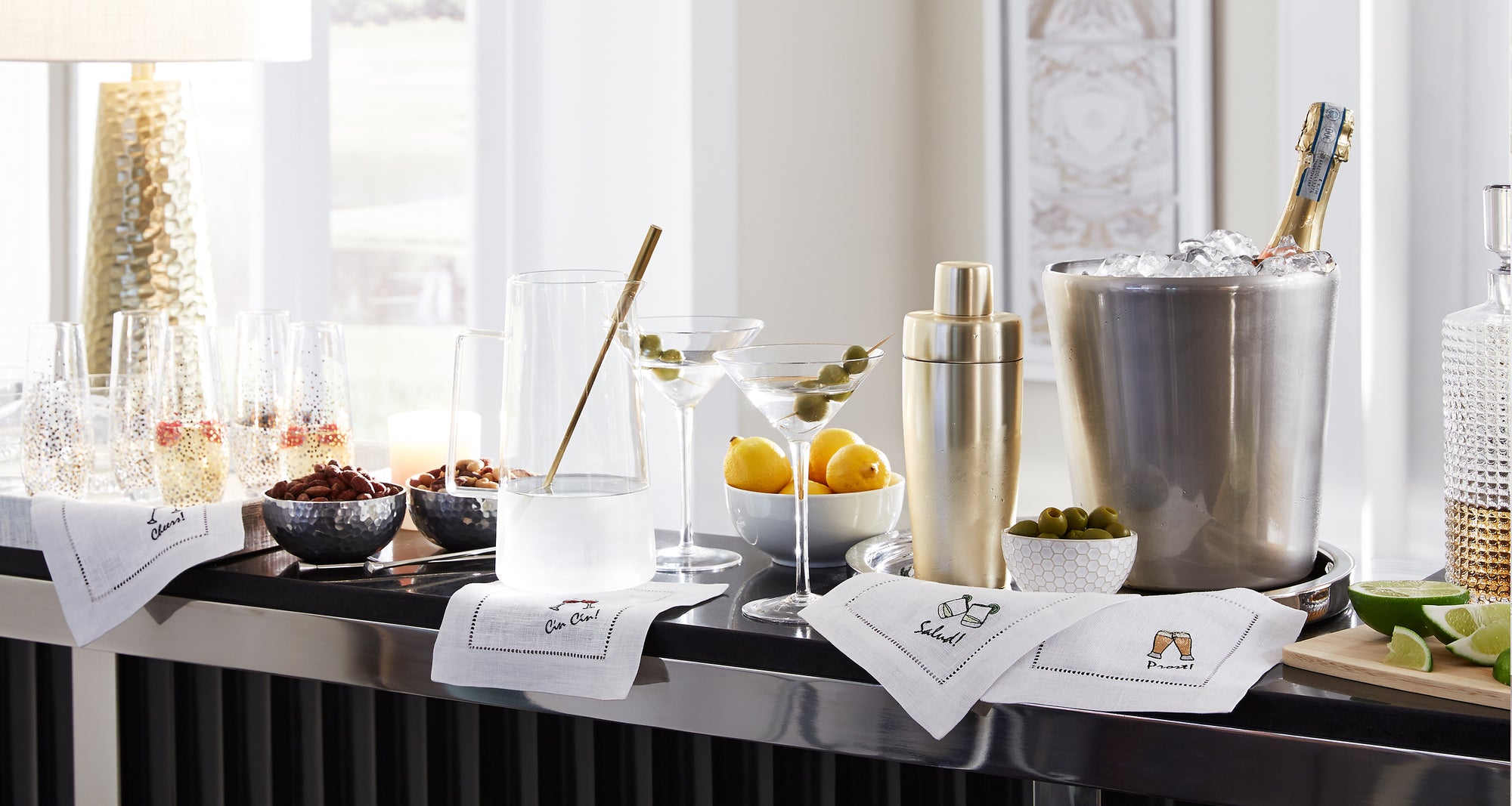 A breakfast tray in morning light on sateen cotton SFERRA bedding.