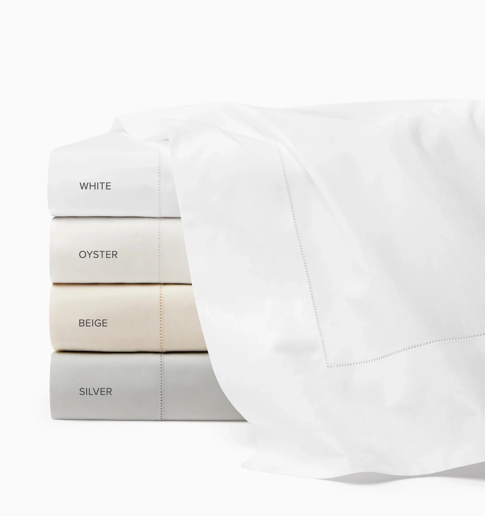 Luxor flat sheet white, oyster, beige and silver stacked and labeled