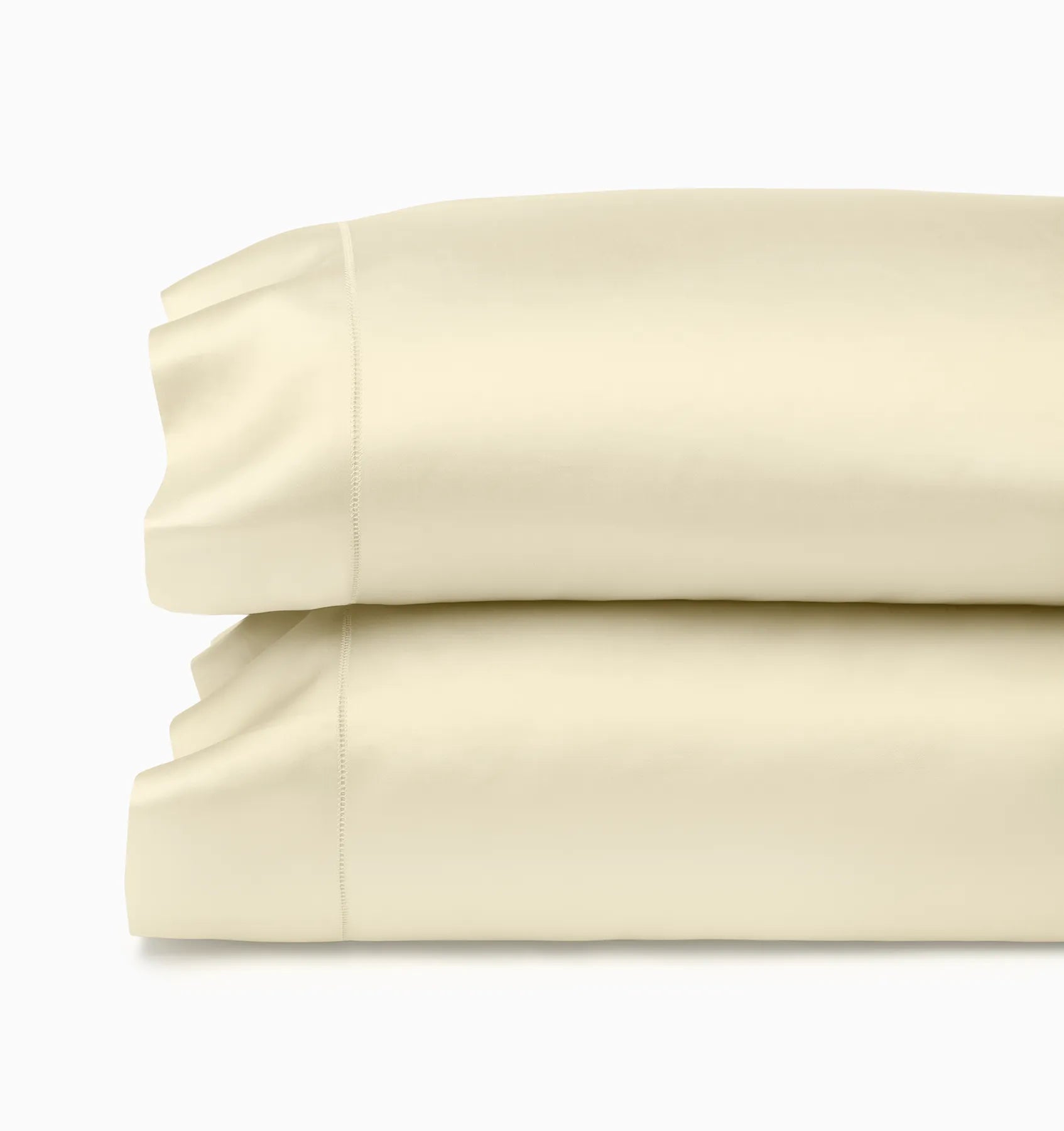Ariel Parchment pillowcases stacked