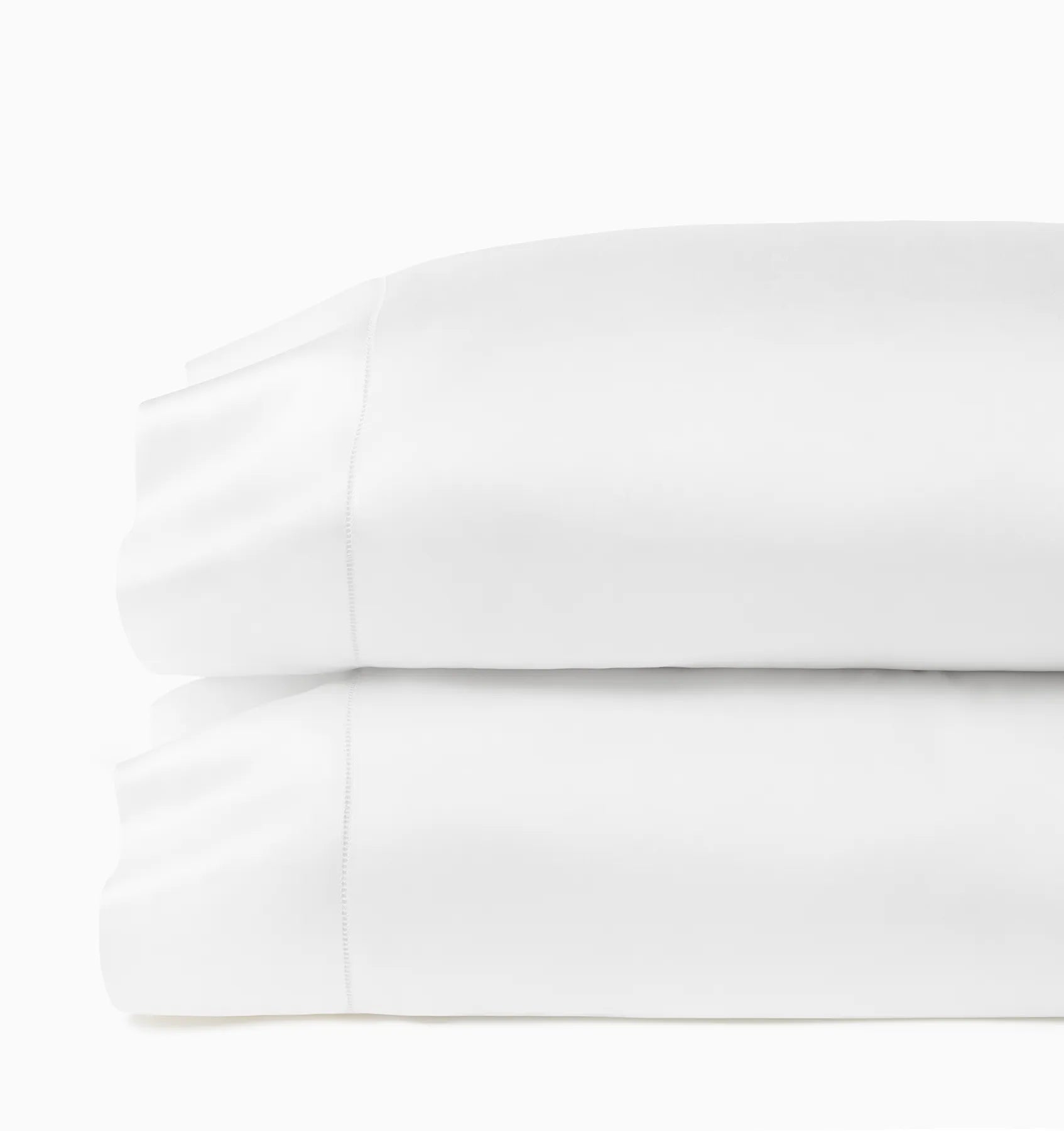 Ariel white pillowcases stacked