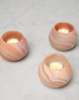 Paprika votive holders lit