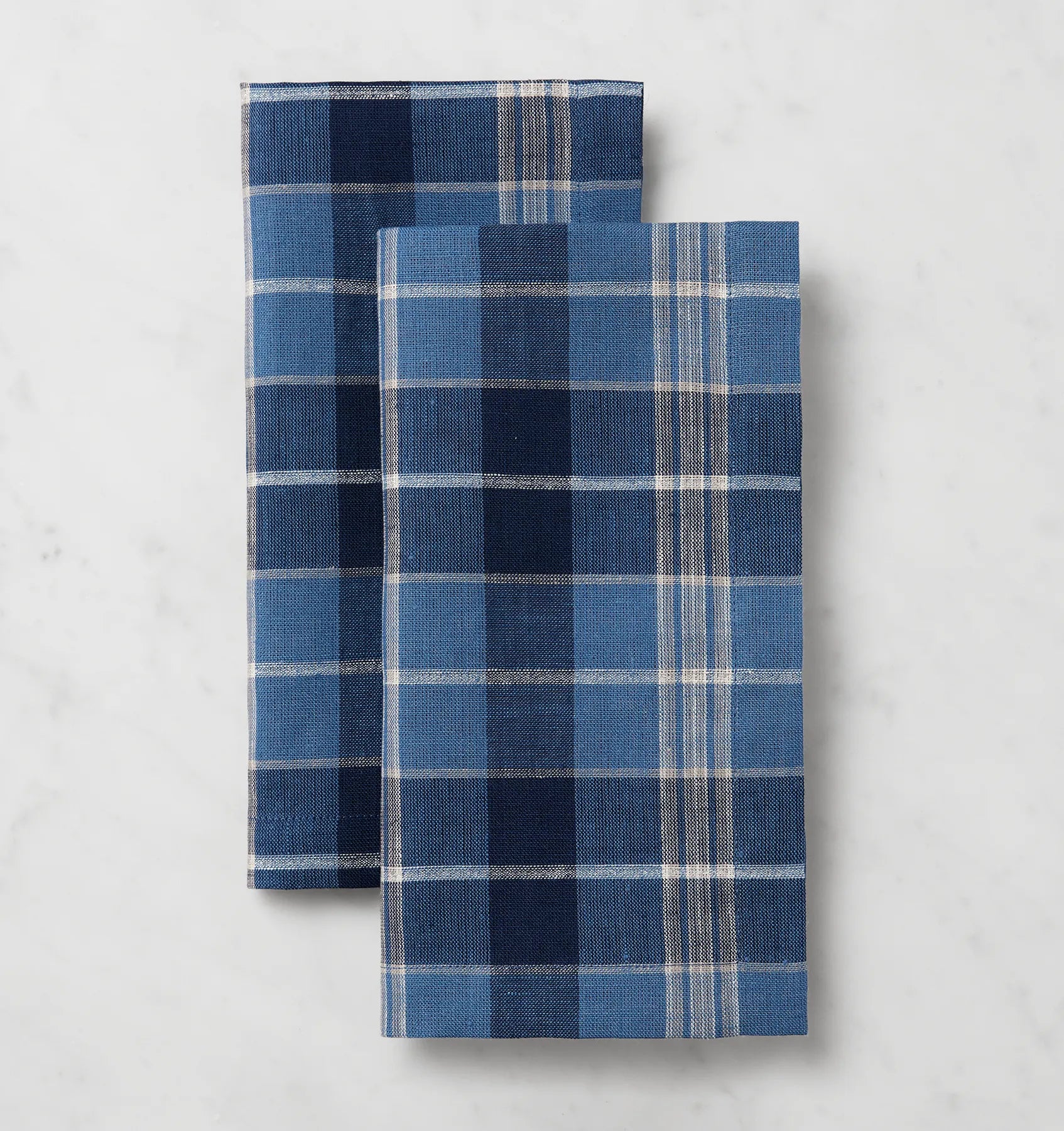 Masseria cadet/navy dinner napkins stacked and folded
