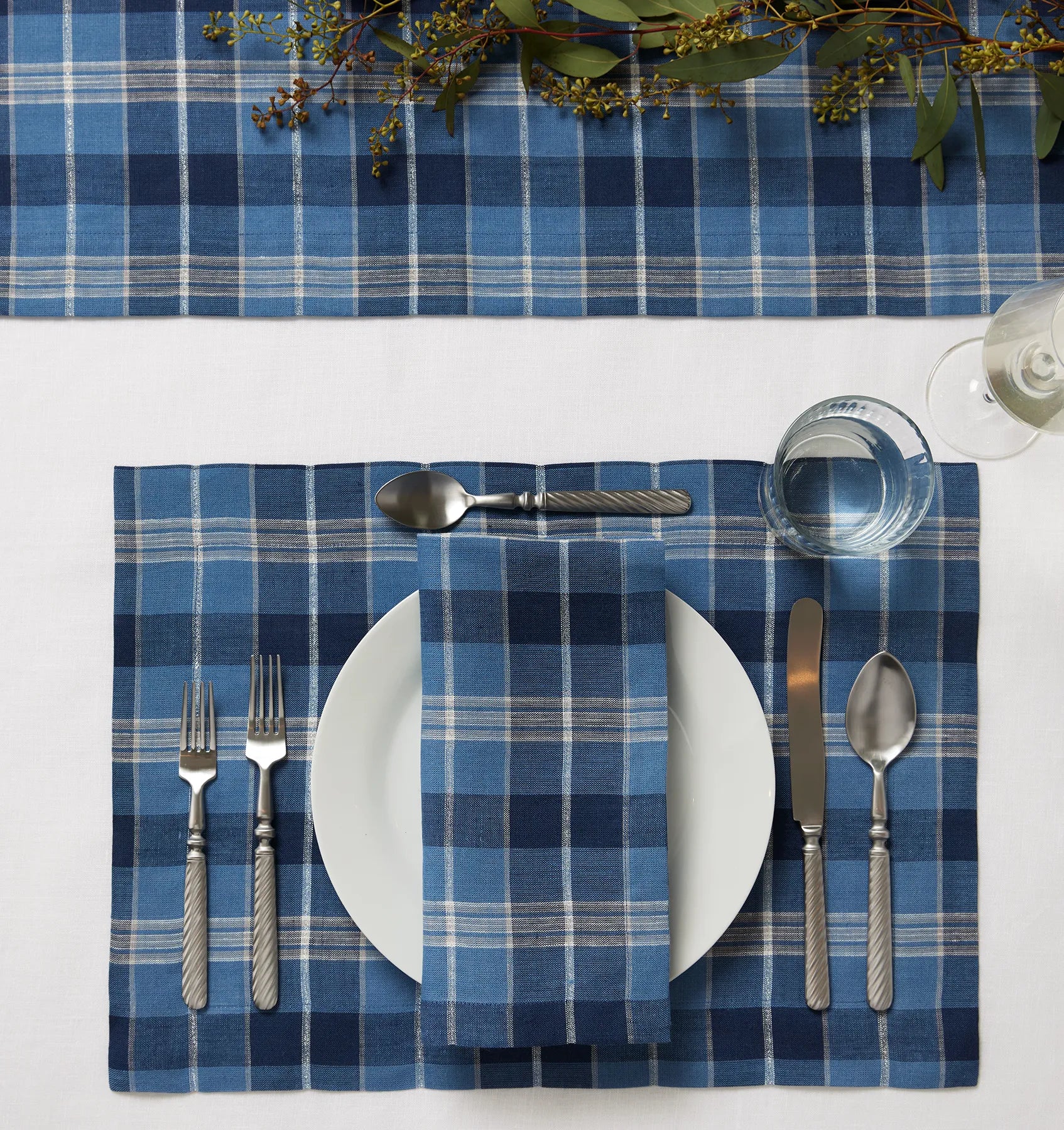 Masseria table linens in Cadet/Navy table setting including the napkin, placemat and table runner.