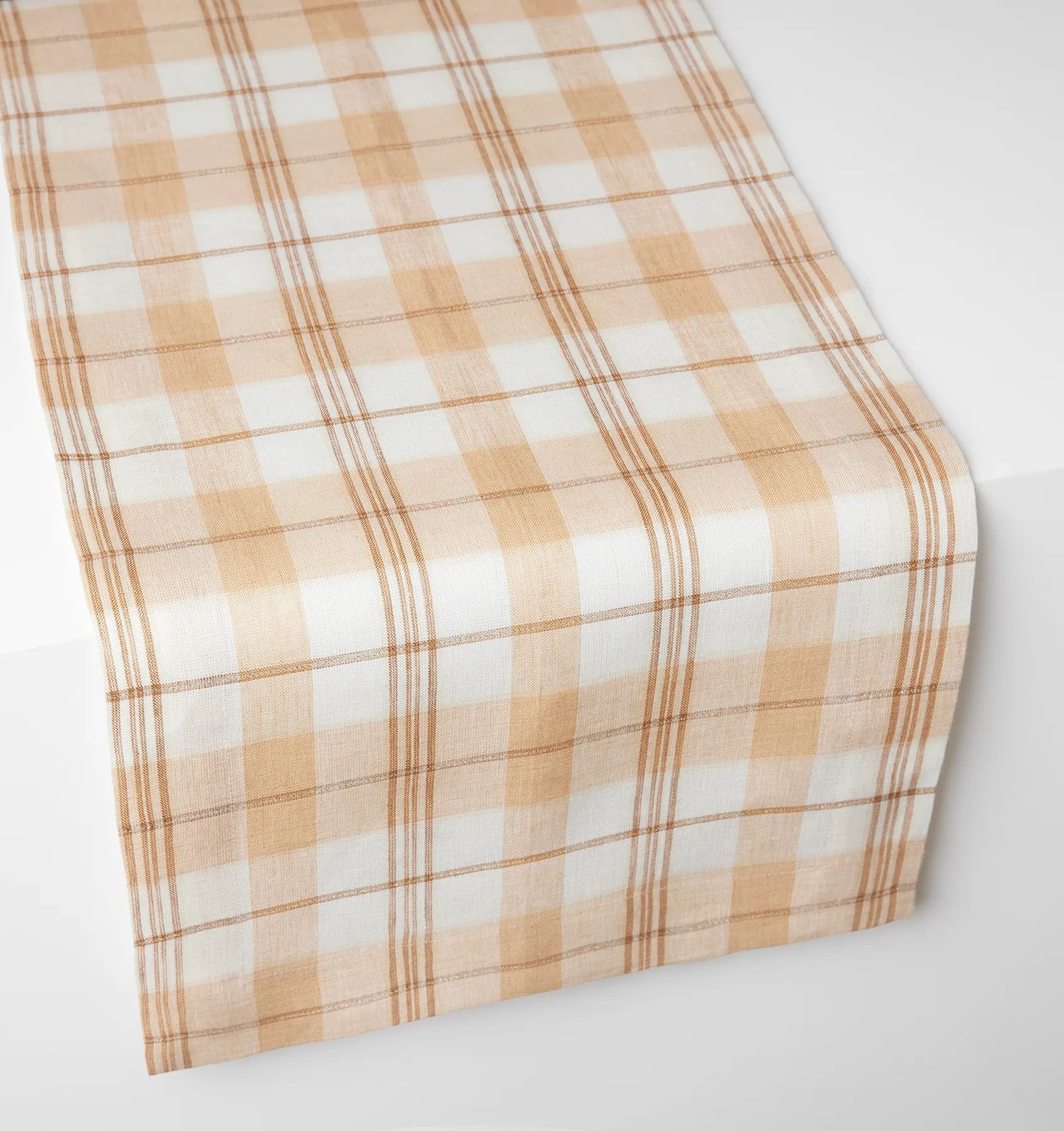 Almond/oyster Masseria table runner on white table