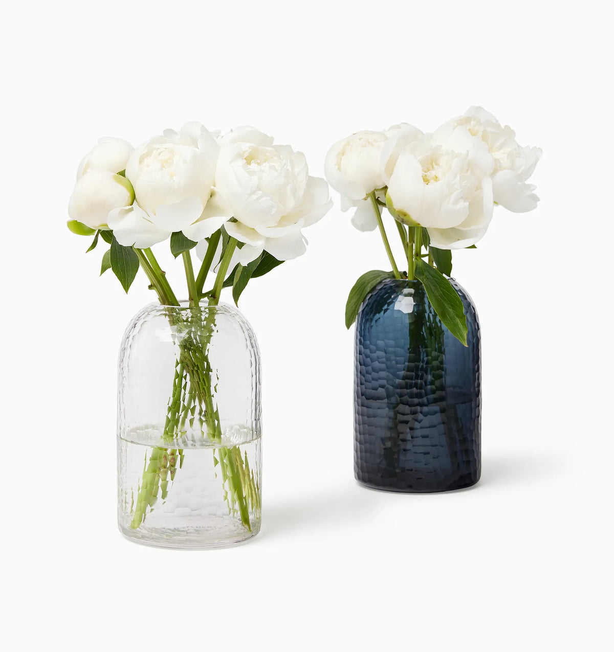 Oculus vase in clear and smoke with white flowers