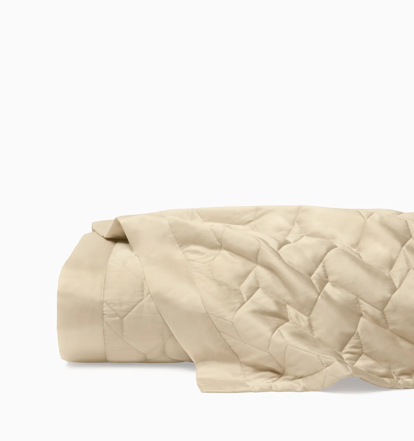 Palatino sand quilt folded on white background