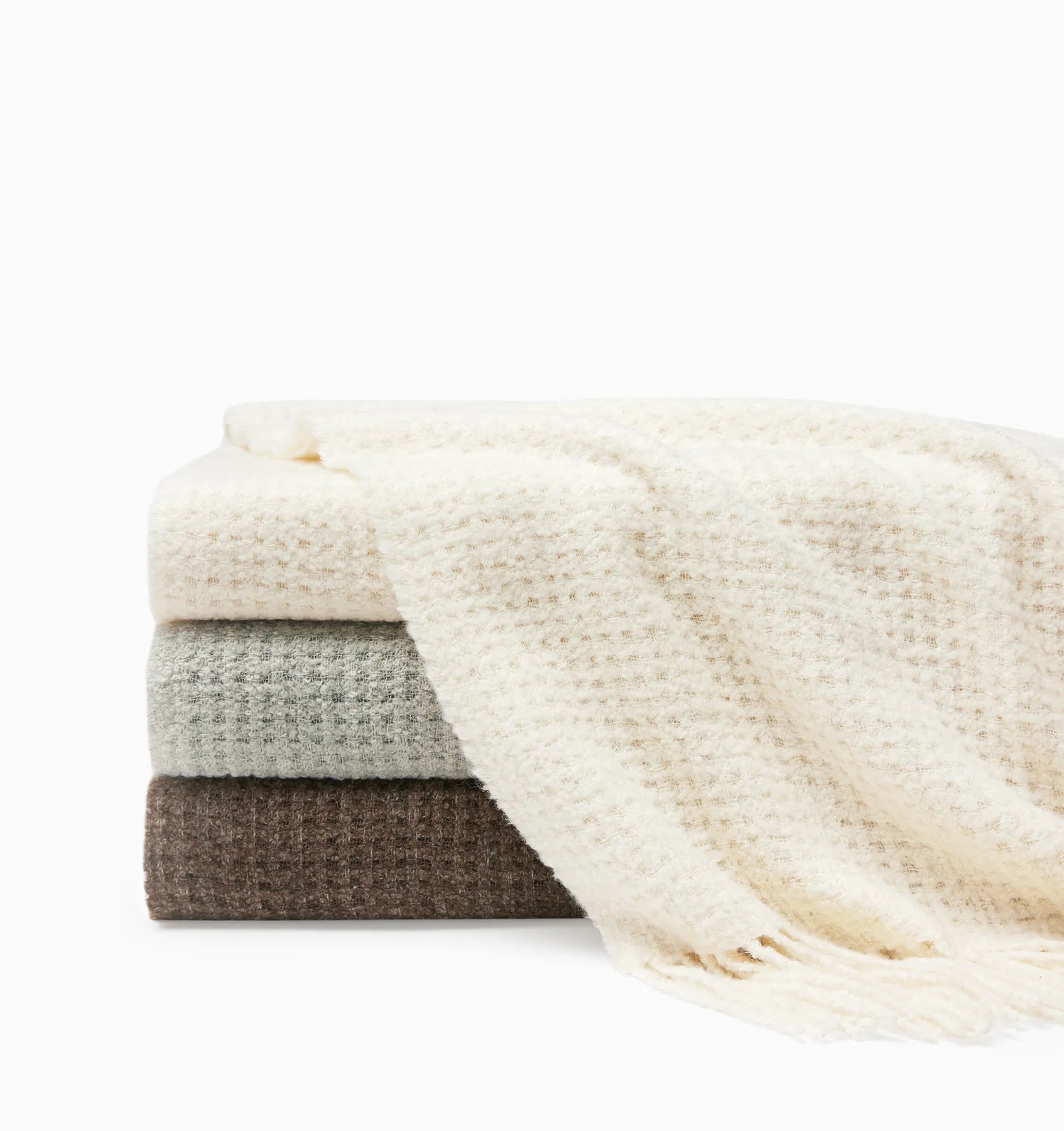 Terranova throw Ivory, Grey and Khaki folded and stacked