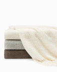 Terranova throw Ivory, Grey and Khaki folded and stacked