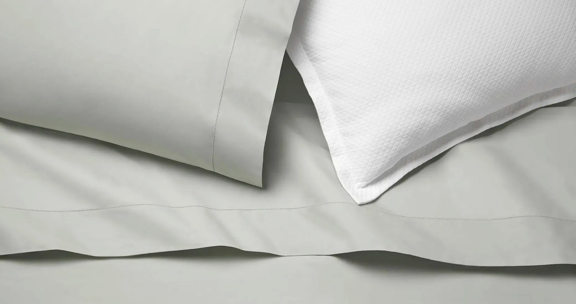 Celeste pillowcase and flat sheet in silver sage with Rombo white sham