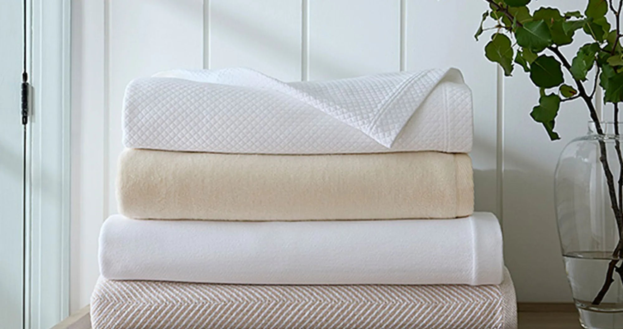 SFERRA blankets folded and stacked