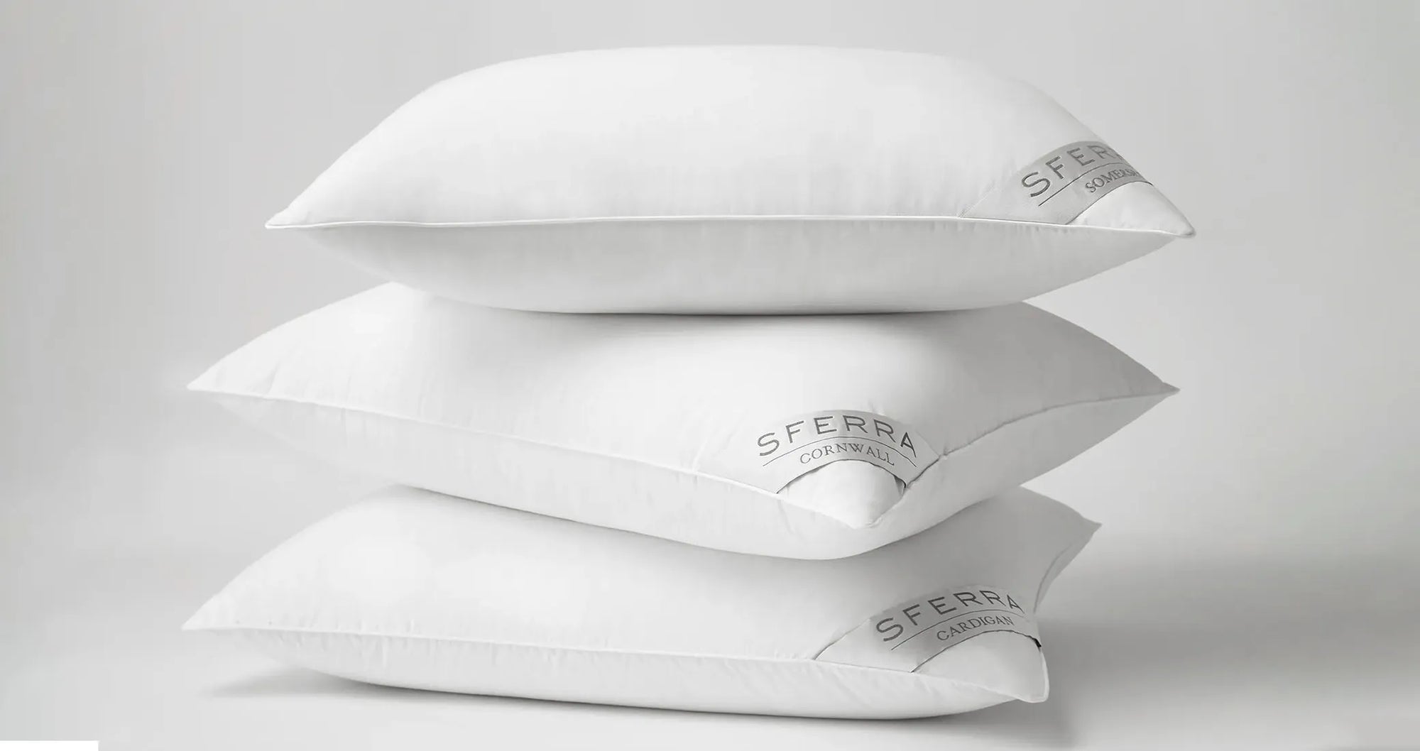 SFERRA Somerset, cornwall and cardigan down pillows stacked