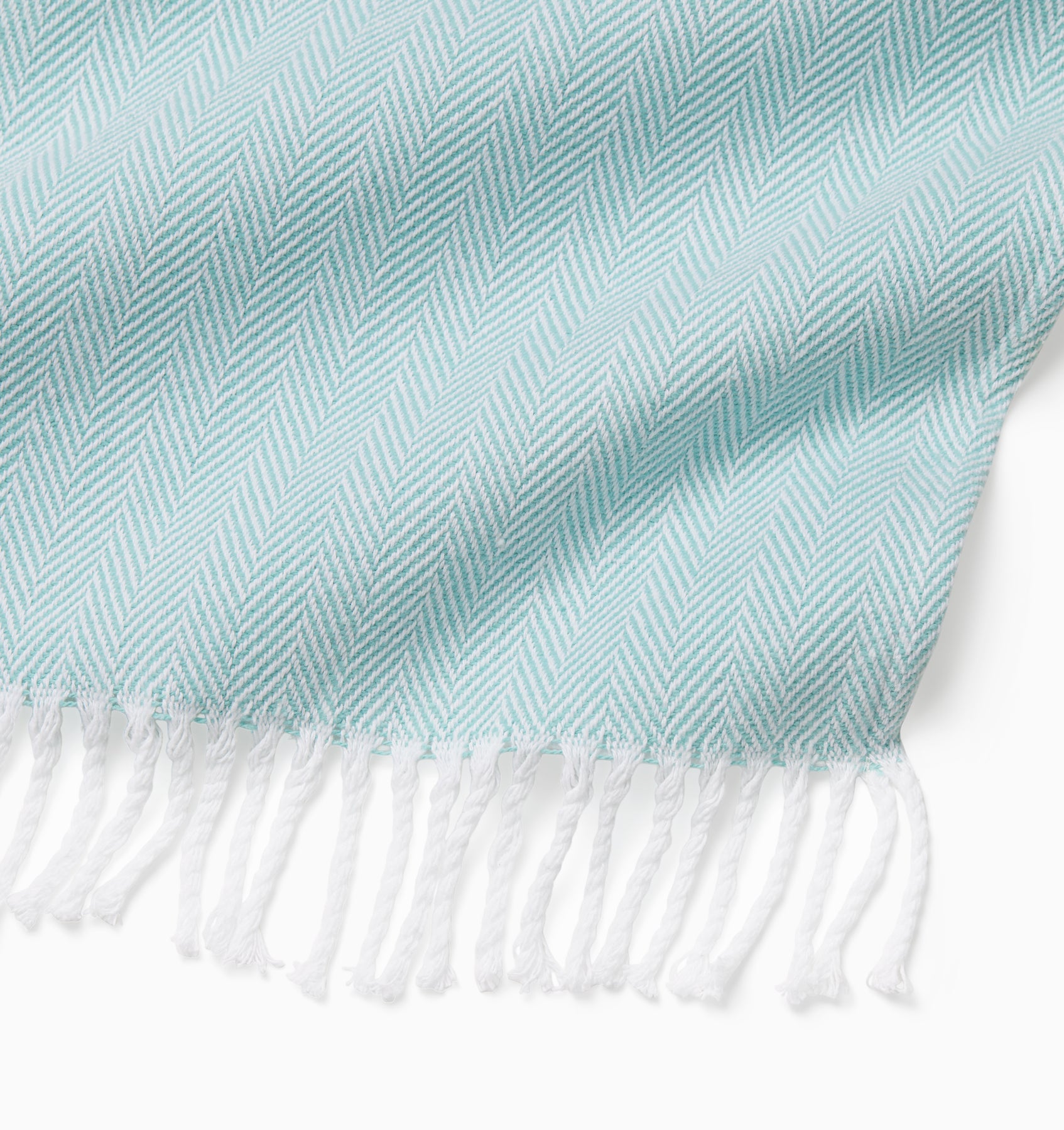 Corner detail of the white/aqua celine throw