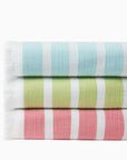 Merlata beach blankets in clearwater, kiwi & coral stacked