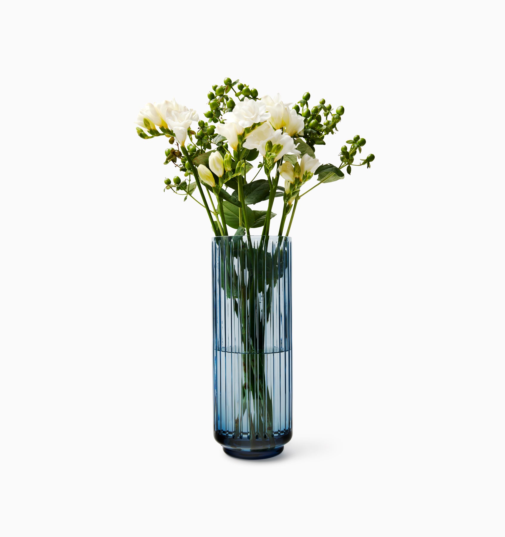 Minerva Blue crystal vase with white flowers 