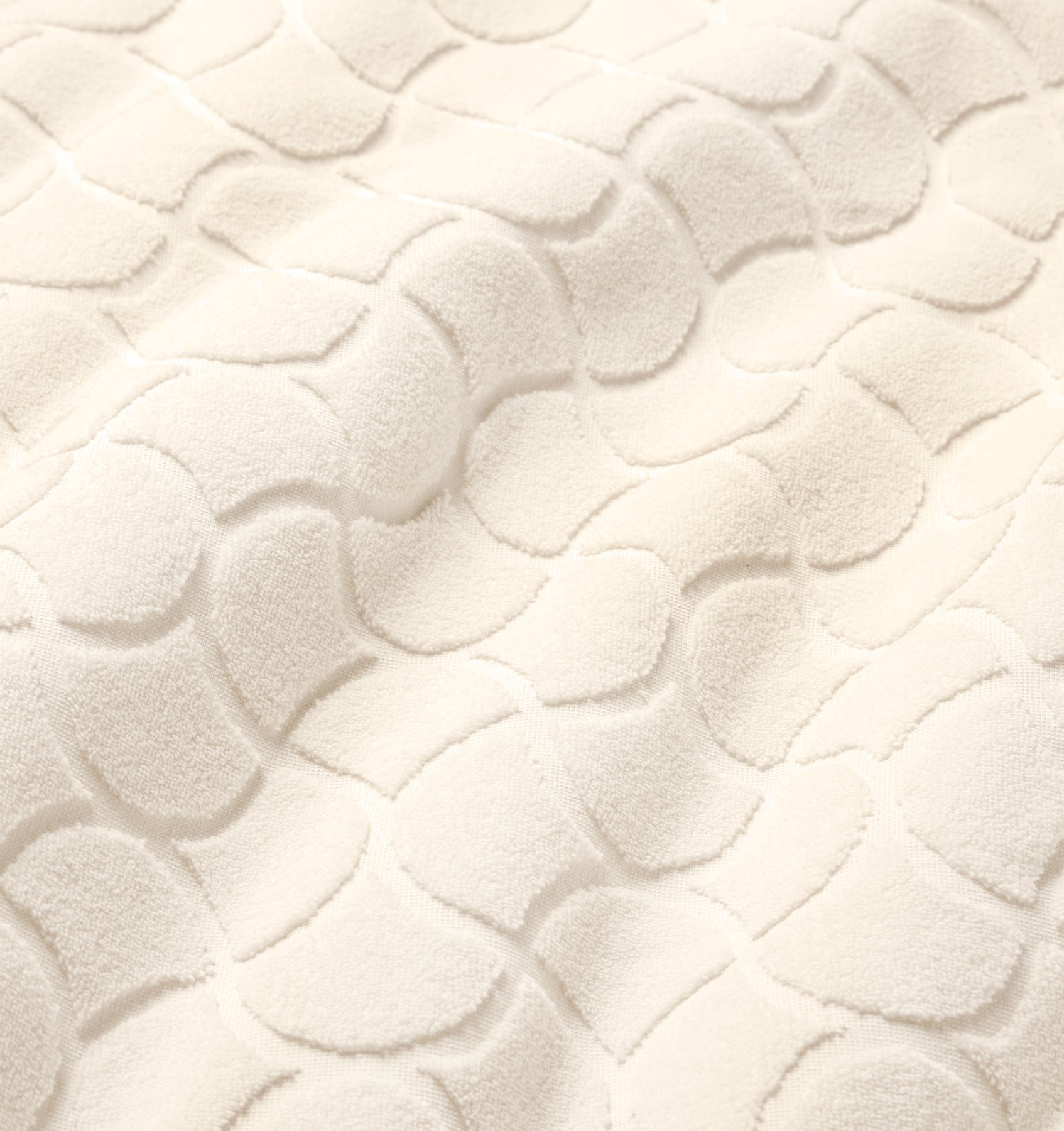 Close-up of textured oasi ivory bath linens