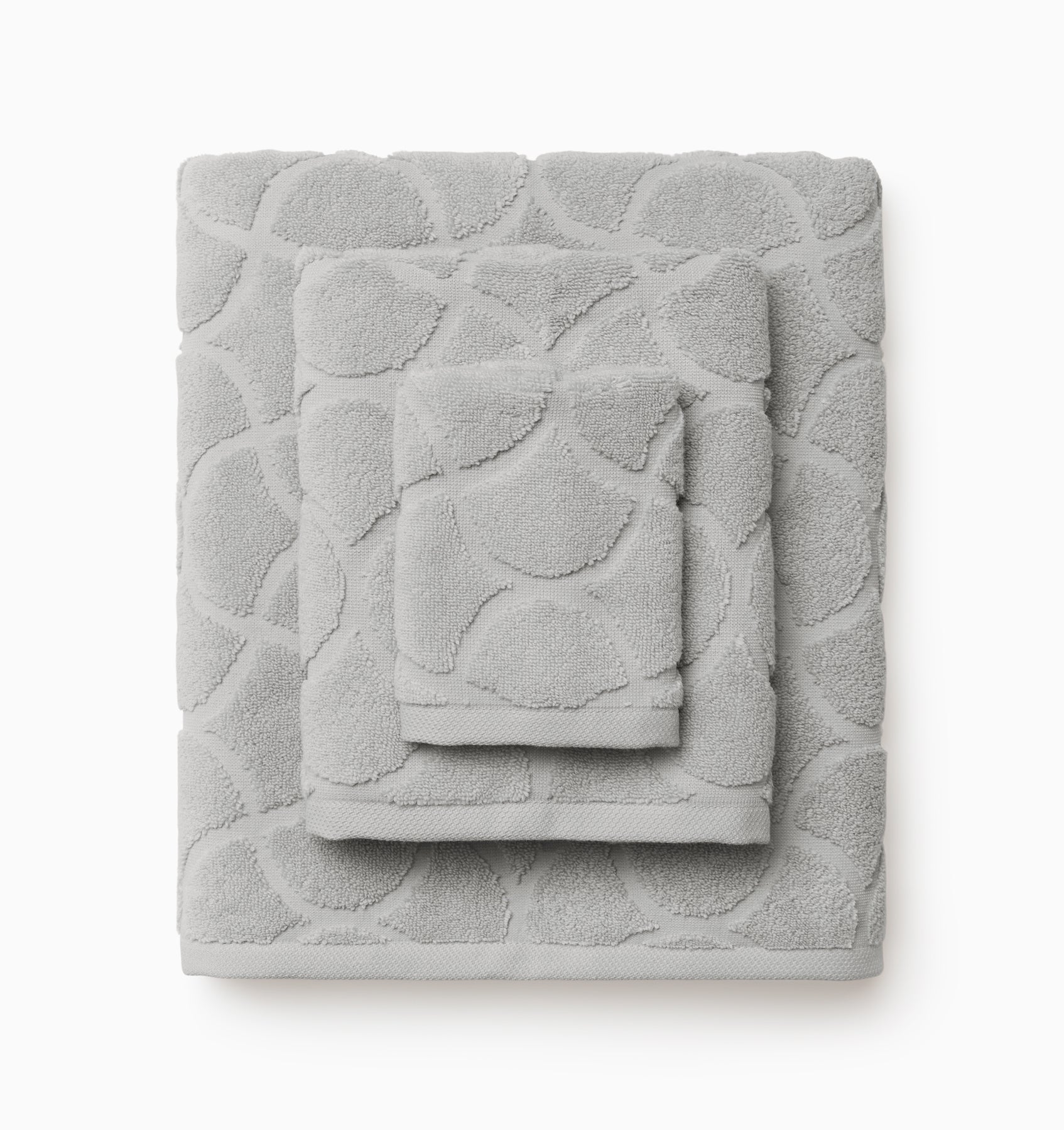 Oasi platinum bath towel, hand towel, and wascloth folded and stacked 