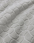 Close-up of textured oasi platinum bath linens