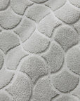 Close-up of textured platinum oasi tub mat fabric
