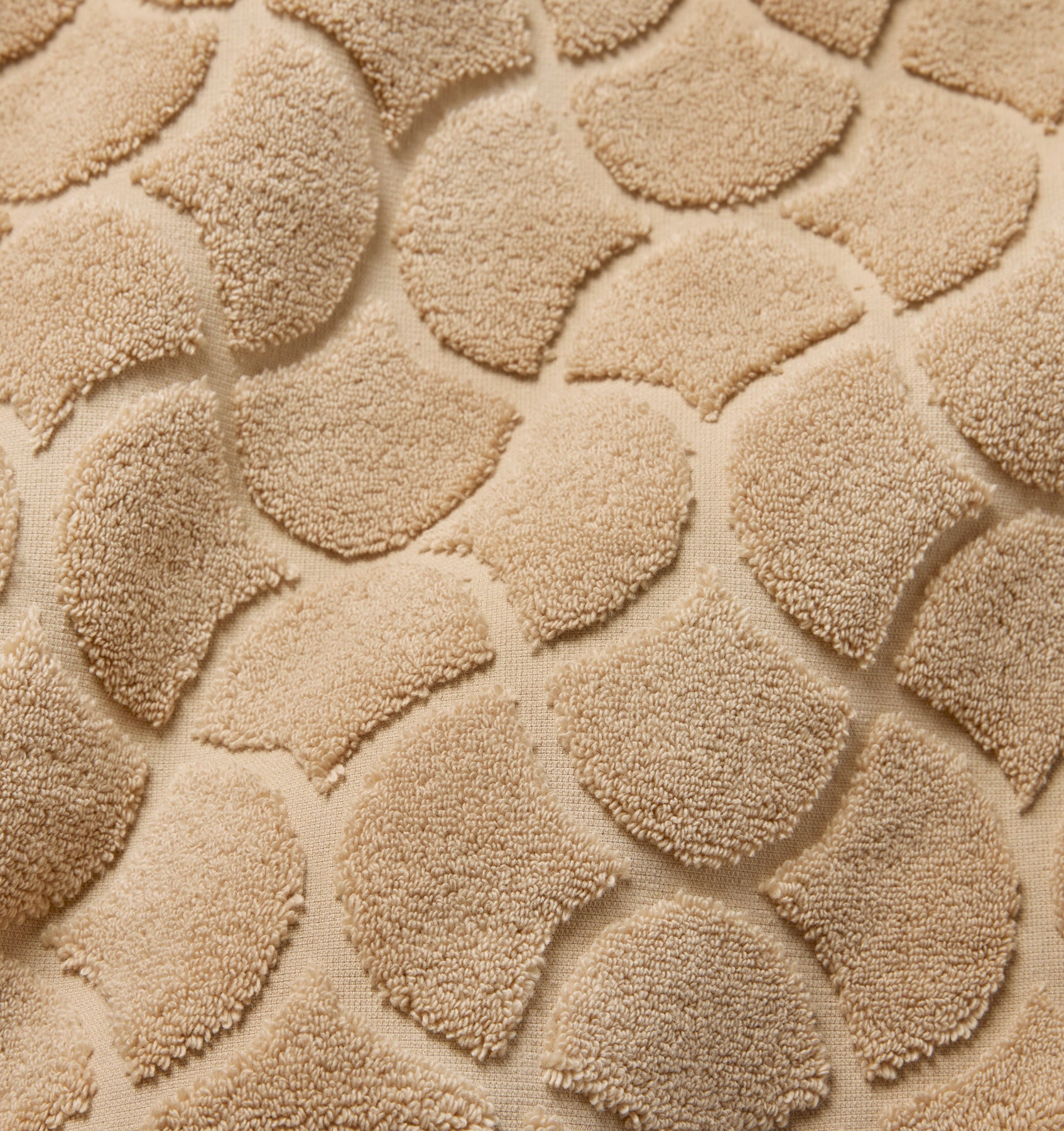 Close-up of textured sand oasi tub mat fabric