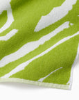 Close-up of a green and white patterned sampieri beach towel