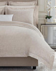 Soft rose and white yarns create an elegant jacquard weave on SFERRA's Amiata Duvet Cover.