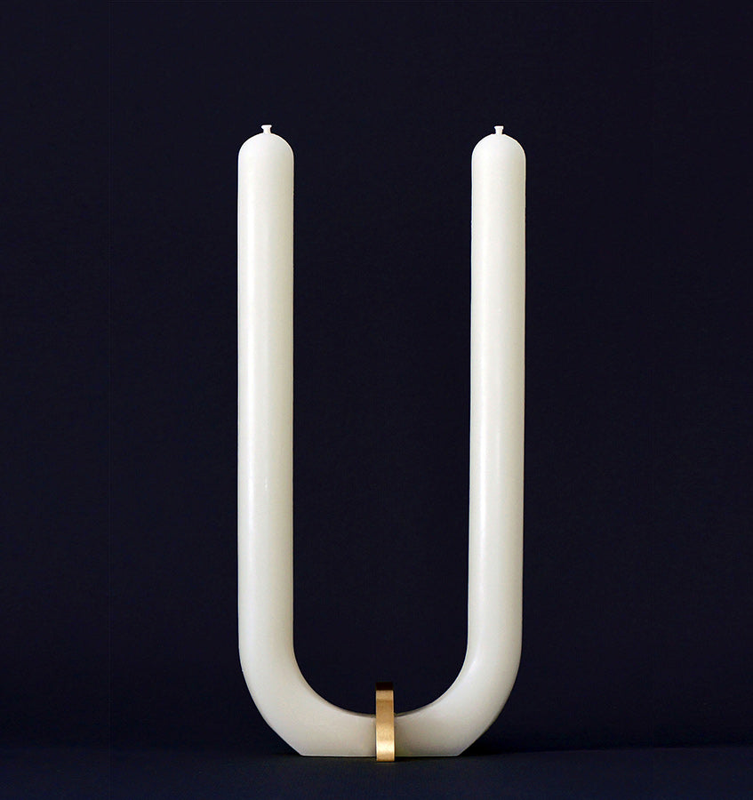  U Candle by Glaze Studio is a hand-poured, dual burning candle made of 100% white beeswax, sold by SFERRA.