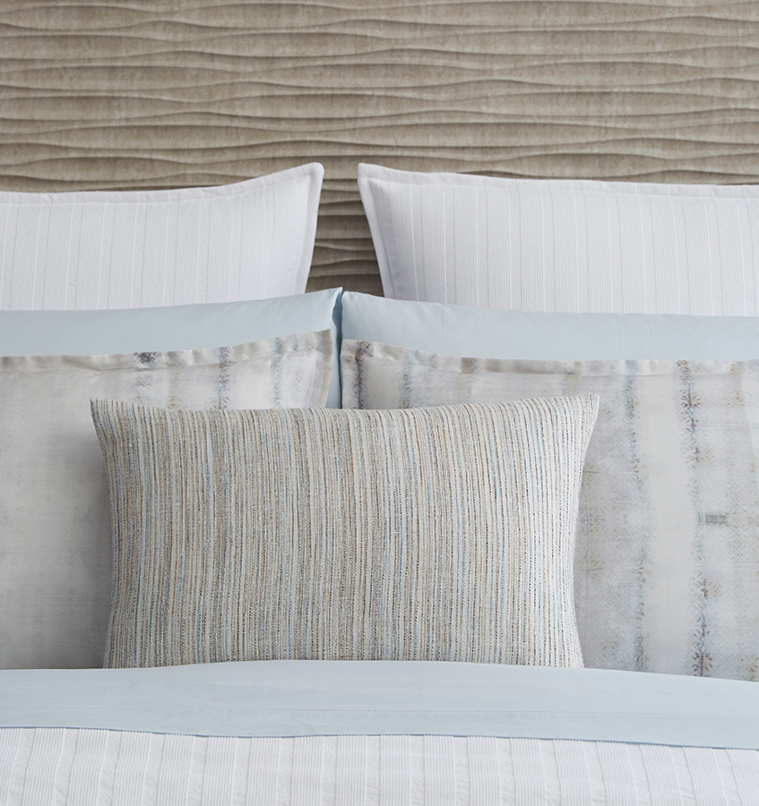SFERRA Minori decorative pillow is characterized by a strié of blue, grey and stone-colored stripes, inspiring a relaxed look of depth and feel.