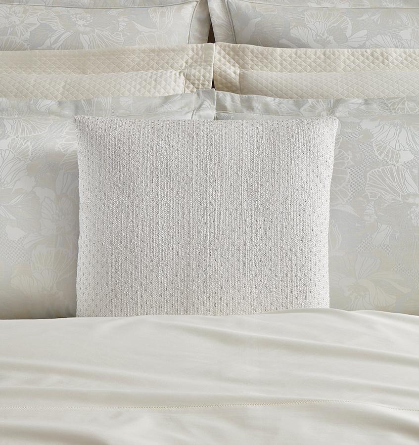 The SFERRA Nemi Decorative Pillow is embroidered with delicate boucle threads in an all-over textural pattern on a white linen base, with silver embroidery details.